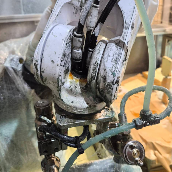 Robot showing chemical corrosion and rust damage
