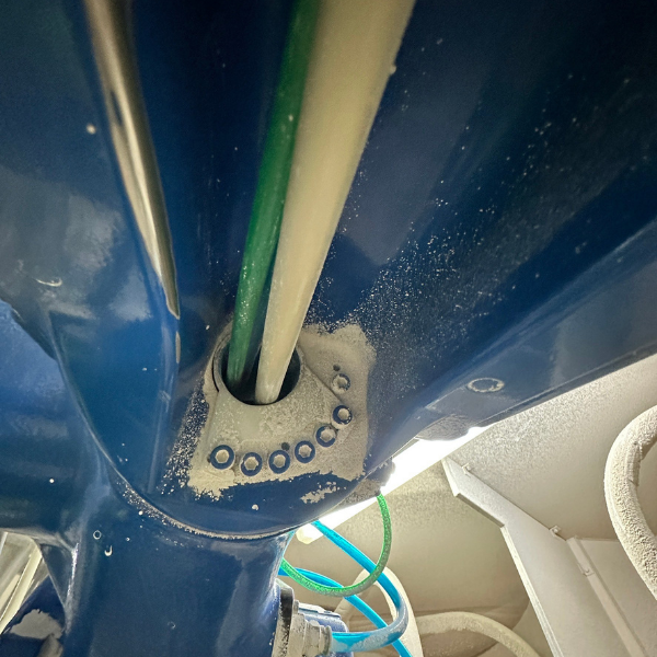 Robot arm coated with oil mist and paint overspray